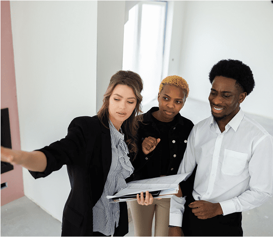 Three people discussing in an office.
